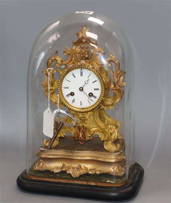 A French bronze mantel clock under dome